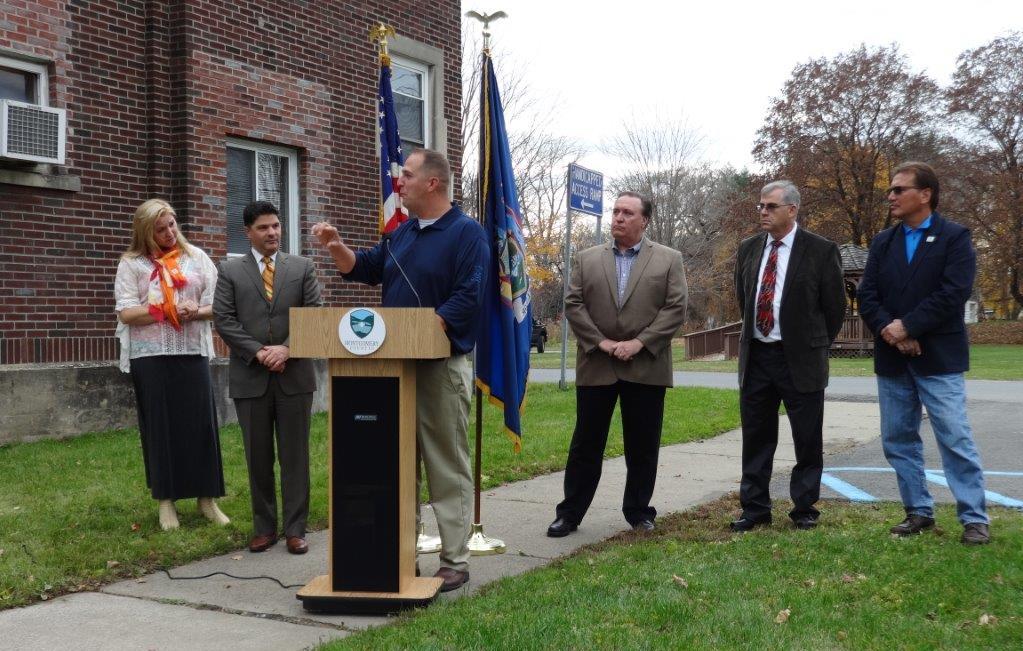 Montgomery County Executive Matthew L. Ossenfort speaks at the county's ceremony to unveil the new mini-bus that will provide service to county veterans